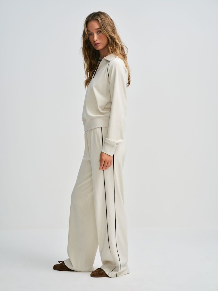 The Set Soft Touch Trophy Neck Sweat Top and Wide Leg Joggers Co-ord Set Cream - Image 1 of 12 The Set Soft Touch Trophy Neck Sweat Top and Wide Leg Joggers Co-ord Set Cream - Image 1 of 12