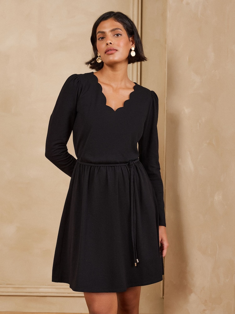 Love & Roses Black Long Sleeve Scallop Mini Dress - Image 1 of 5 Love & Roses Black Long Sleeve Scallop Mini Dress - Image 1 of 5