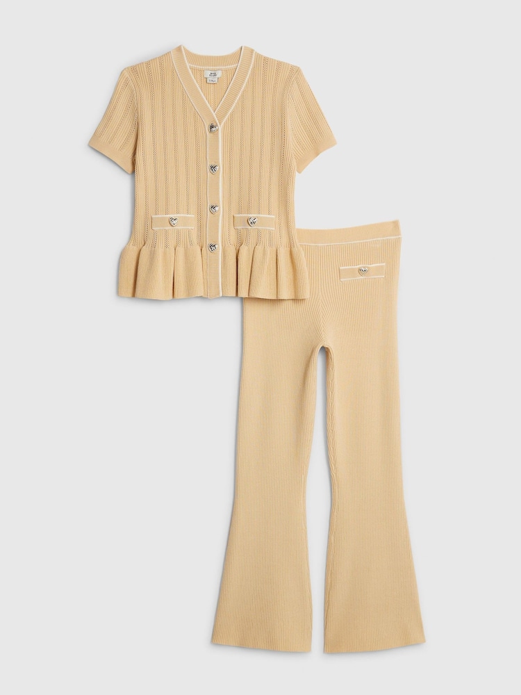 حزمة من سترة كارديغان محبوكة بكشكشة وبنطلون بتصميم واسع من أسفل من River Island - صورة 1 من 5 حزمة من سترة كارديغان محبوكة بكشكشة وبنطلون بتصميم واسع من أسفل من River Island - صورة 1 من 5