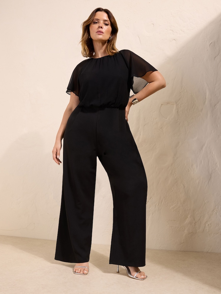 Friends Like These Black Curve Chiffon Flutter Sleeve Scuba Jumpsuit - Image 1 of 5 Friends Like These Black Curve Chiffon Flutter Sleeve Scuba Jumpsuit - Image 1 of 5
