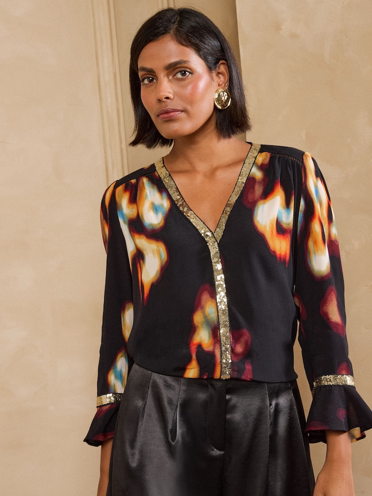 Love & Roses Black Abstract Print Sequin Trim 3/4 Flute Sleeve Blouse - Image 1 of 5