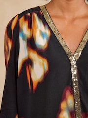 Love & Roses Black Abstract Print Sequin Trim 3/4 Flute Sleeve Blouse - Image 2 of 5