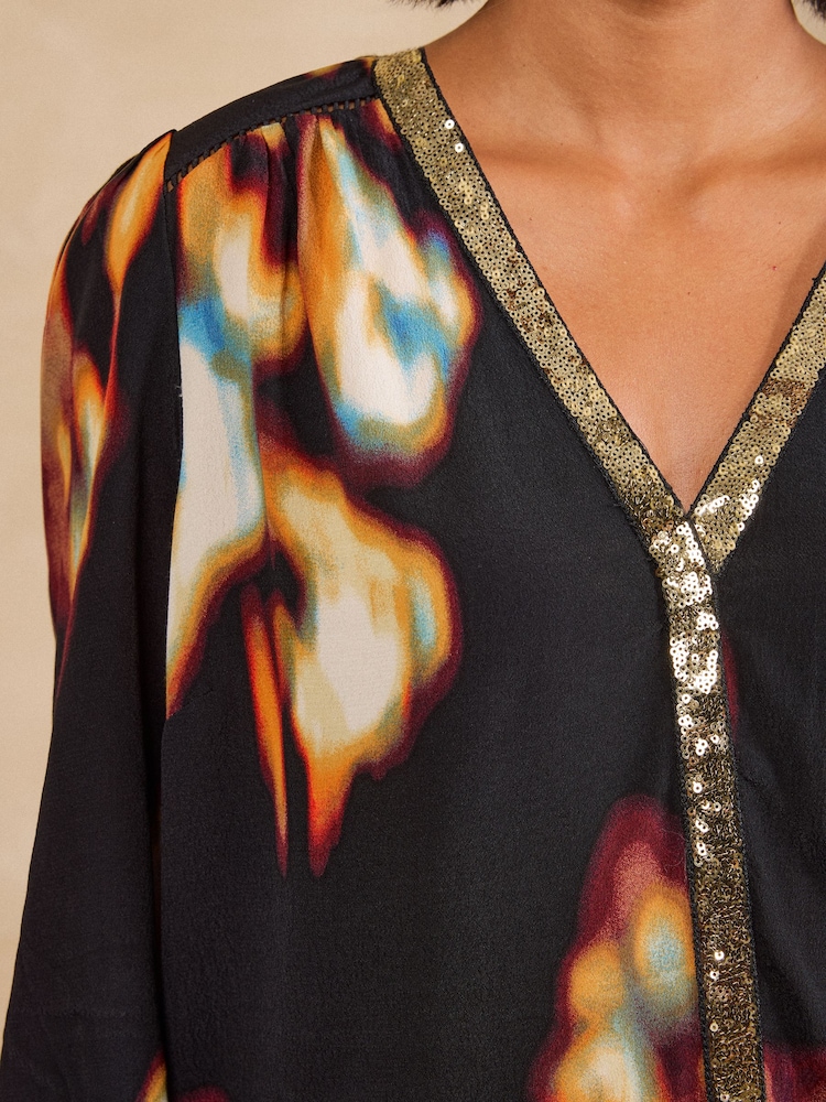 Love & Roses Black Abstract Print Sequin Trim 3/4 Flute Sleeve Blouse - Image 2 of 5