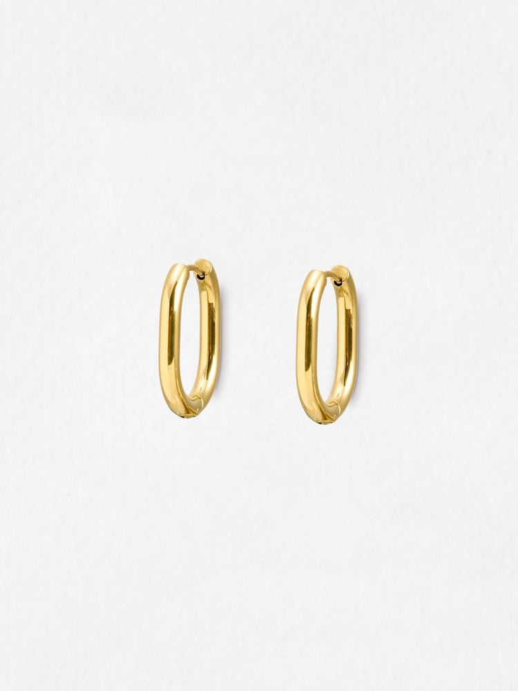 Oliver Bonas Gold Wren Gold Tone Stainless Steel Waterproof Oval Hoop Earrings - Image 1 of 5