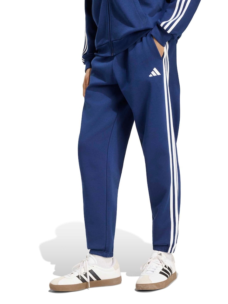 Blå - adidas Essentials 3-Striber fleecetilspidsede joggingbukser med manchetter - Billede 1 af 6
