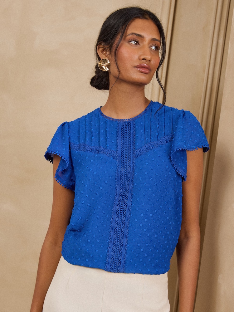 Love & Roses Cobalt Blue Dobby Flutter Sleeve Shell Top - Image 1 of 4