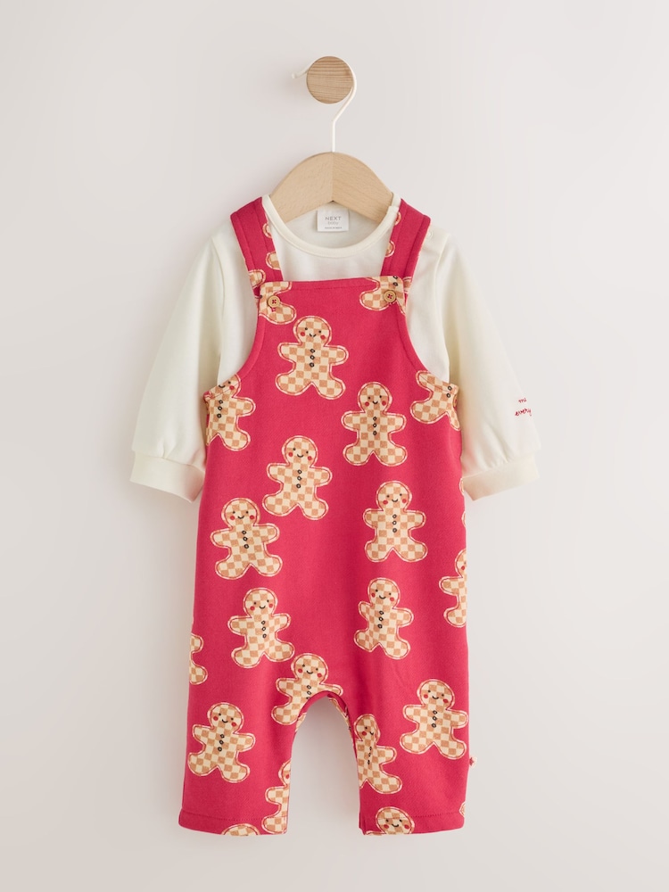 Red Gingerbread Man Jersey Christmas Dungaree and Bodysuit Baby Set (0mths-3yrs) - Image 1 of 7 Red Gingerbread Man Jersey Christmas Dungaree and Bodysuit Baby Set (0mths-3yrs) - Image 1 of 7