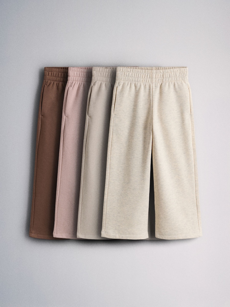The Set 4 Pack Wide Leg Joggers Pink/Cream/Light Brown/Chocolate Brown - Image 1 of 7 The Set 4 Pack Wide Leg Joggers Pink/Cream/Light Brown/Chocolate Brown - Image 1 of 7