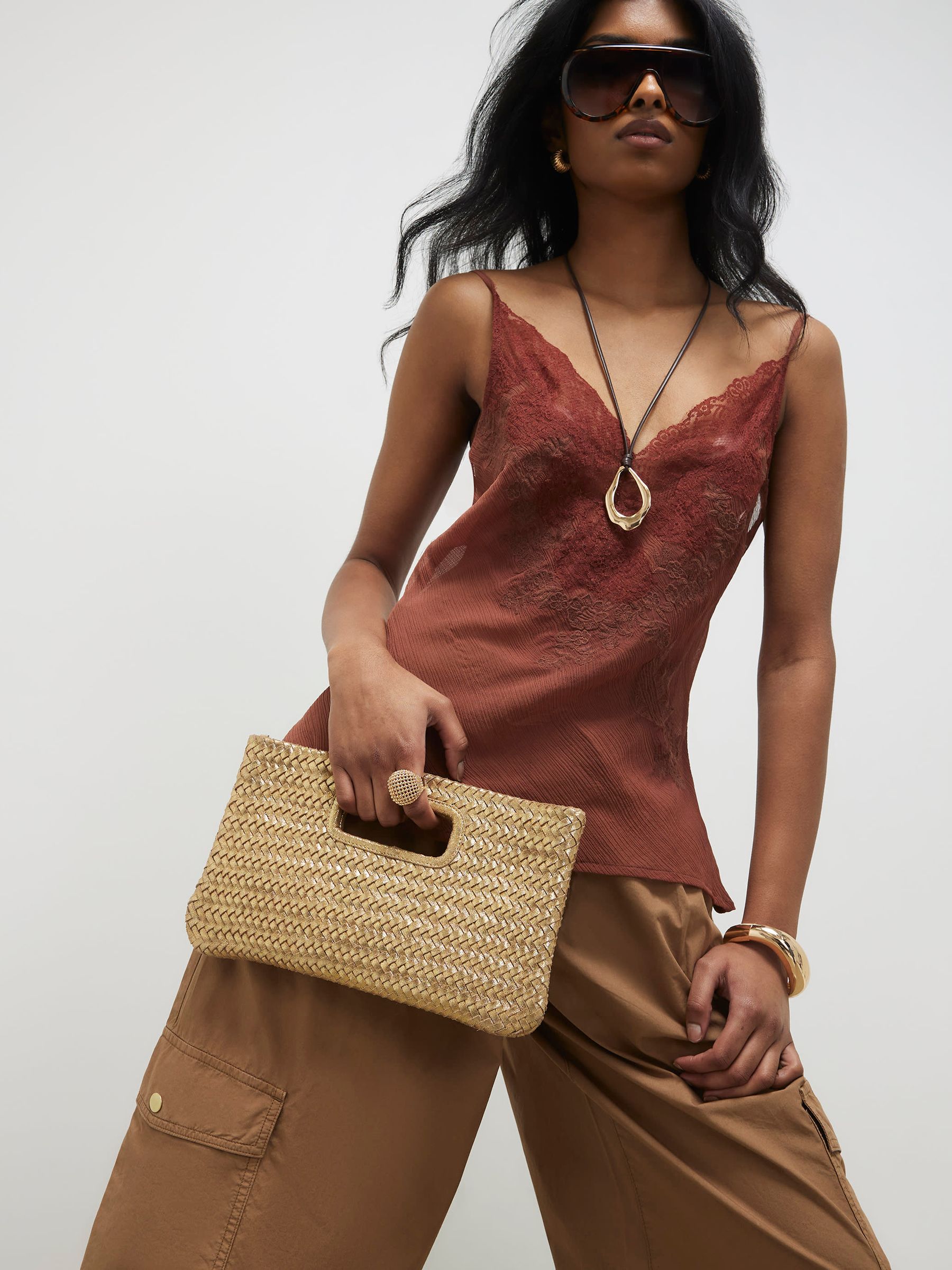 Buy River Island Gold Woven Leather Clutch from Next USA