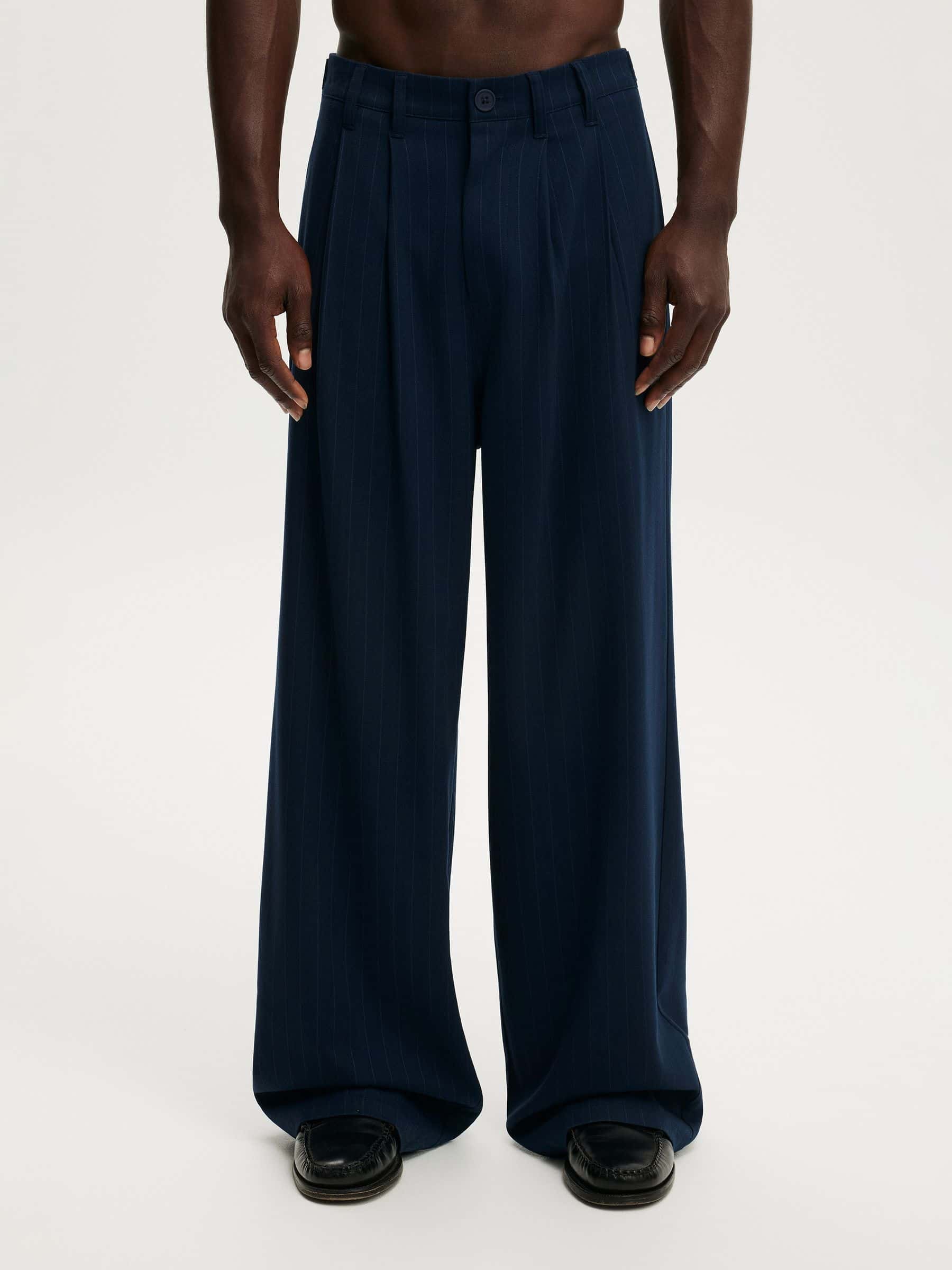 Buy Cotton On Navy Pinstripe Super Baggy Pleated Trousers from