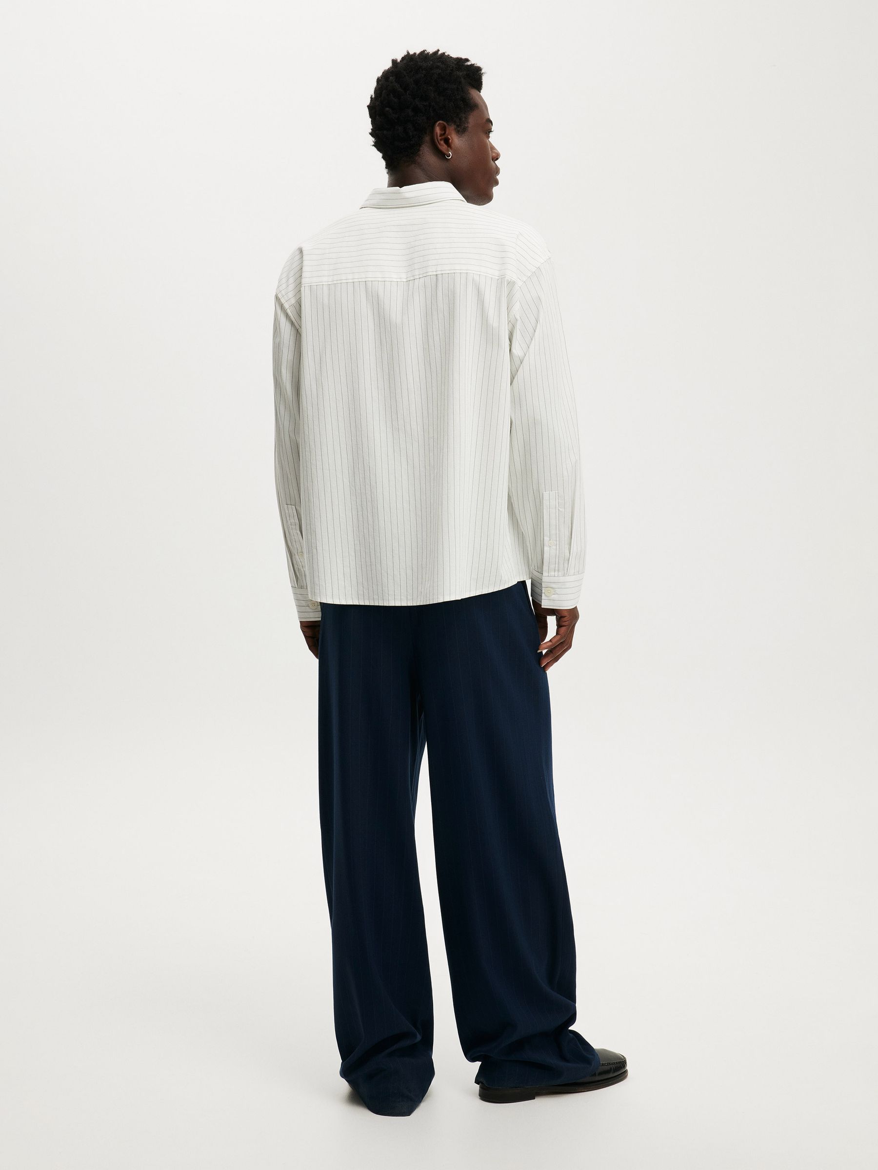 Buy Cotton On Navy Pinstripe Super Baggy Pleated Trousers from