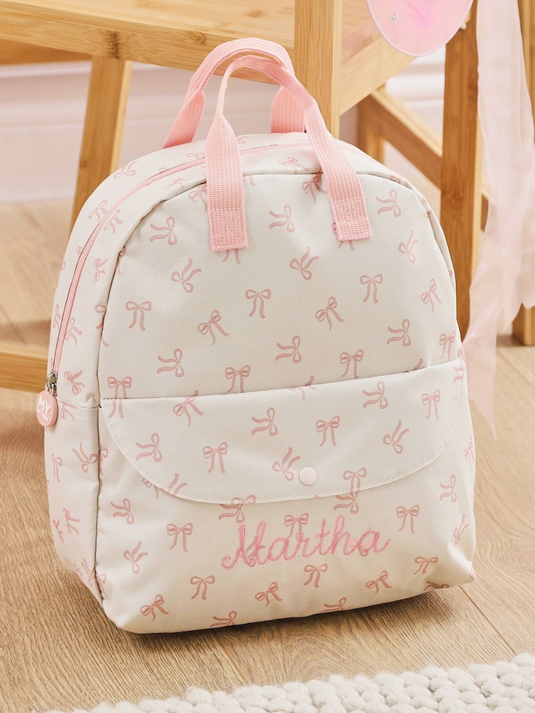 Personalised Bow All-Over Print Medium Backpack by My 1st Years - Image 1 of 3 Personalised Bow All-Over Print Medium Backpack by My 1st Years - Image 1 of 3
