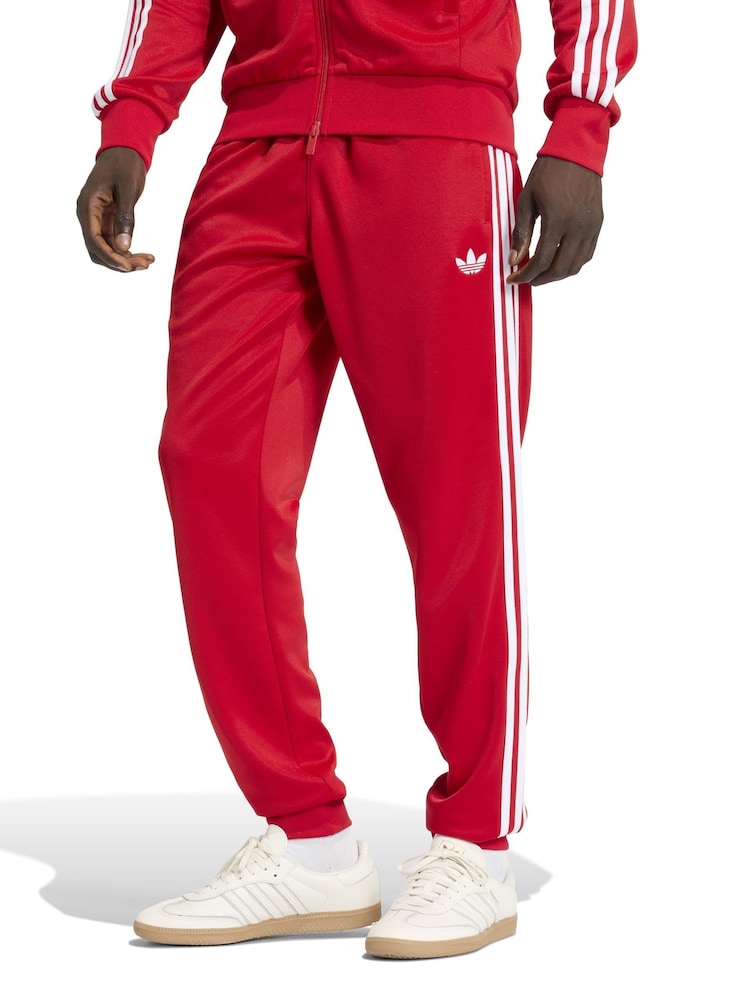 adidas Originals Red SST Track Joggers - Image 1 of 6 adidas Originals Red SST Track Joggers - Image 1 of 6