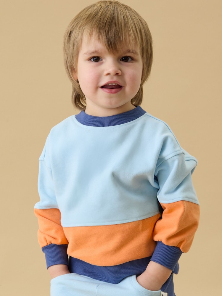 Πορτοκαλί - Φούτερ KIDLY by MORI Colorblock από απαλό βαμβάκι με φαρδιά μανίκια - Εικόνα 1 από 6