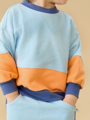 Πορτοκαλί - Φούτερ KIDLY by MORI Colorblock από απαλό βαμβάκι με φαρδιά μανίκια - Εικόνα 3 από 6