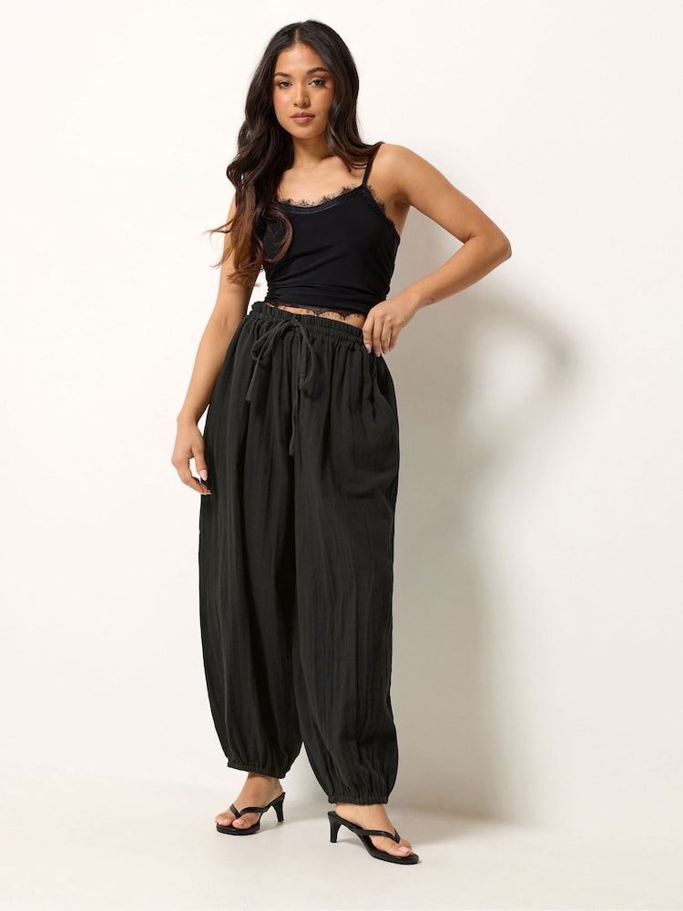 PixieGirl Petite Black Cheesecloth Balloon Trousers - Image 1 of 5 PixieGirl Petite Black Cheesecloth Balloon Trousers - Image 1 of 5