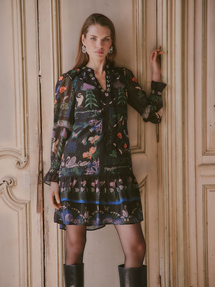 Love & Roses X V&A Black Petite Printed Embellished Neck Drop Waist Mini Dress - Image 1 of 6 Love & Roses X V&A Black Petite Printed Embellished Neck Drop Waist Mini Dress - Image 1 of 6