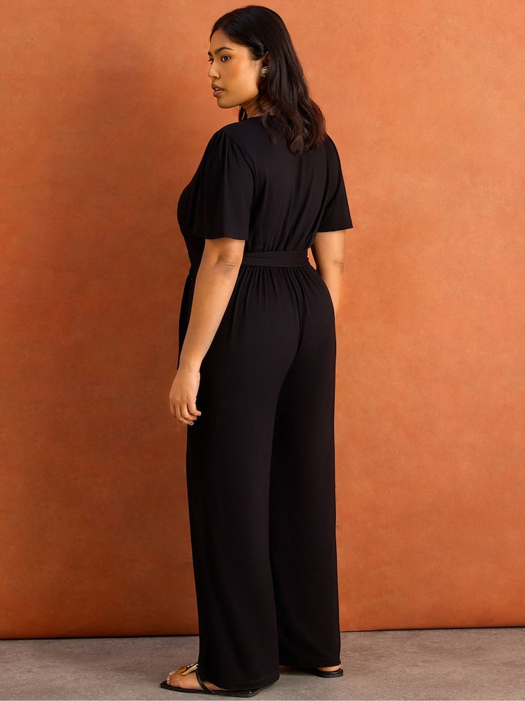 Live Unlimited Black V-Neck Wrap Flutter Sleeve Jersey Jumpsuit - Image 6 of 6