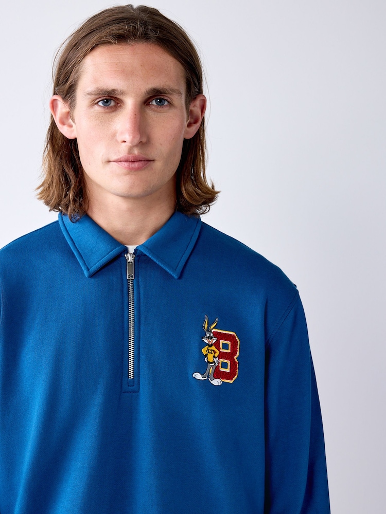 Common Couch Bug Buy Blue Bugs Bunny License Graphic Zip Polo Sweatshirt from the Next ...