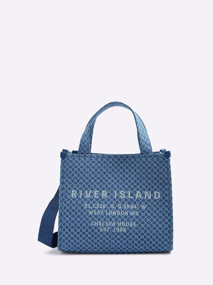 River Island Blue Medium Monogram Denim Embossed Tote Bag - Image 1 of 6 River Island Blue Medium Monogram Denim Embossed Tote Bag - Image 1 of 6