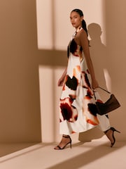 Ecru/ Orange Floral Print Halter Twist Neck Midi Dress - Image 1 of 10