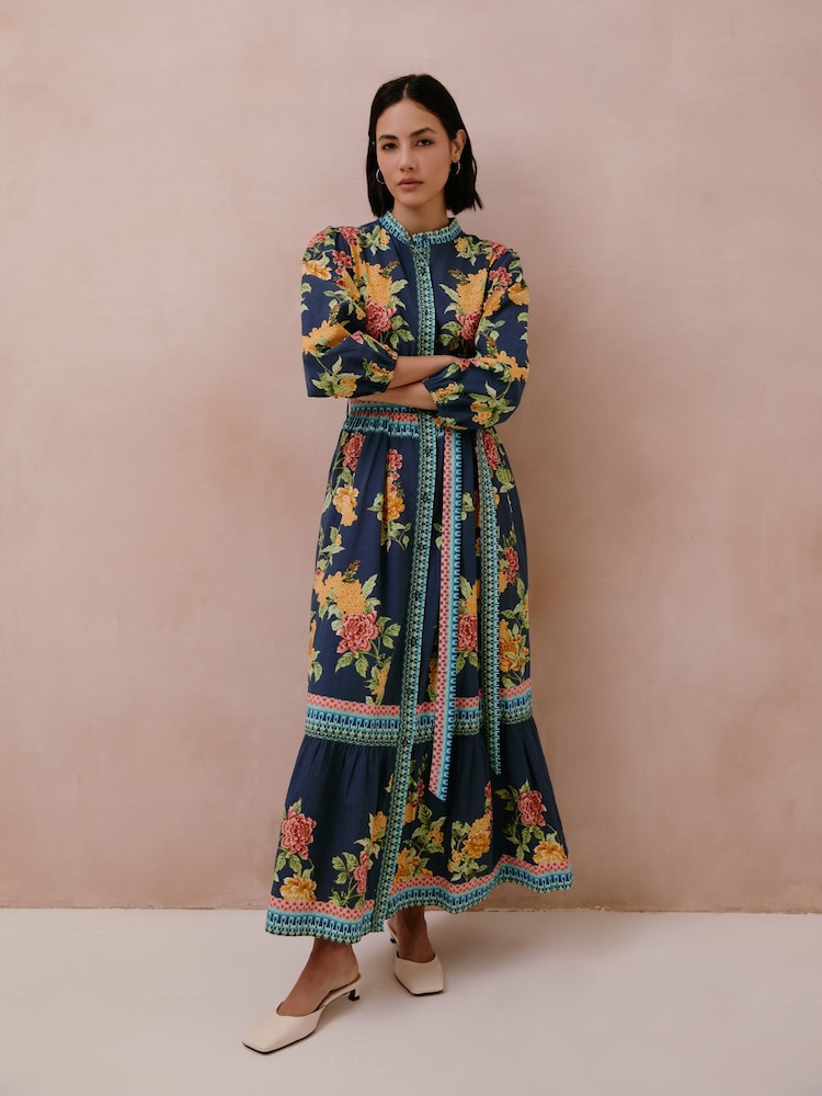 Raishma Amber Dress A High Neckline Three-Quarter Sleeves Intricate Border Detailing And A Matching Fabric Belt Cinching The Waist - صورة 1 من 3
