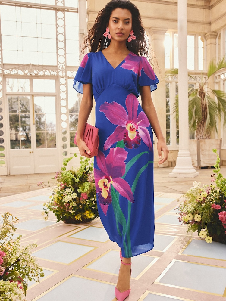 Love & Roses x RHS Cobalt Blue Floral Placement Petite Satin Flutter Sleeve Midi Dress - Image 1 of 5 Love & Roses x RHS Cobalt Blue Floral Placement Petite Satin Flutter Sleeve Midi Dress - Image 1 of 5