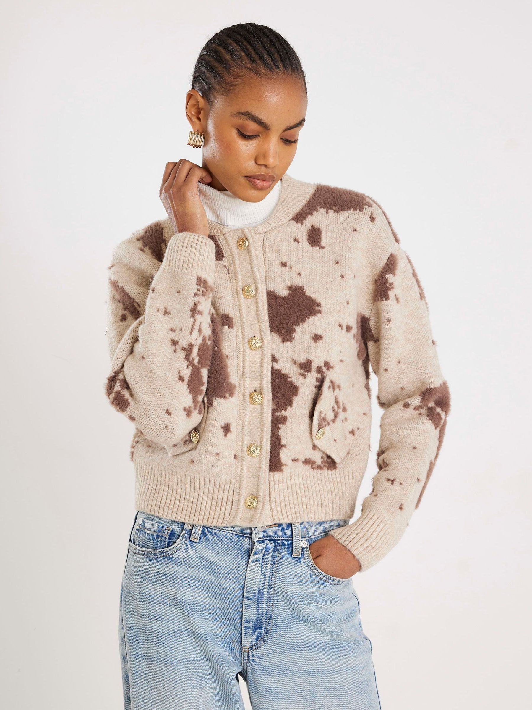 Buy River Island Cream Cow Print Knitted Bomber Jacket from the