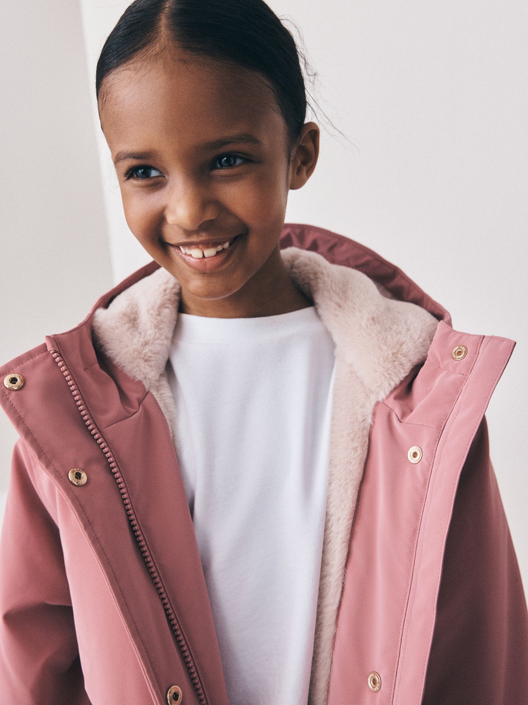 Buy Pink Shower Resistant Faux Fur Lined Jacket (3-16yrs) from the