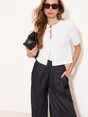 Lipsy Ivory Short Sleeve Ribbed Knit Buttoned Shrug Cardigan - Image 1 of 4