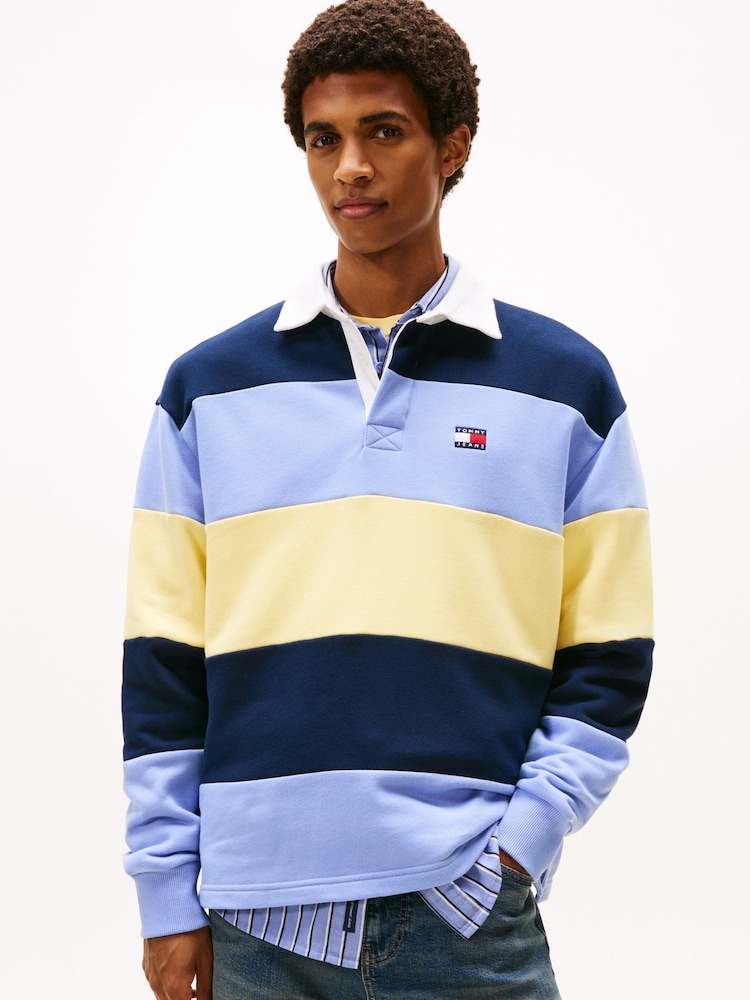 Tommy Jeans Blue Badge Stripe Relaxed Rugby Shirt - Image 1 of 5 Tommy Jeans Blue Badge Stripe Relaxed Rugby Shirt - Image 1 of 5