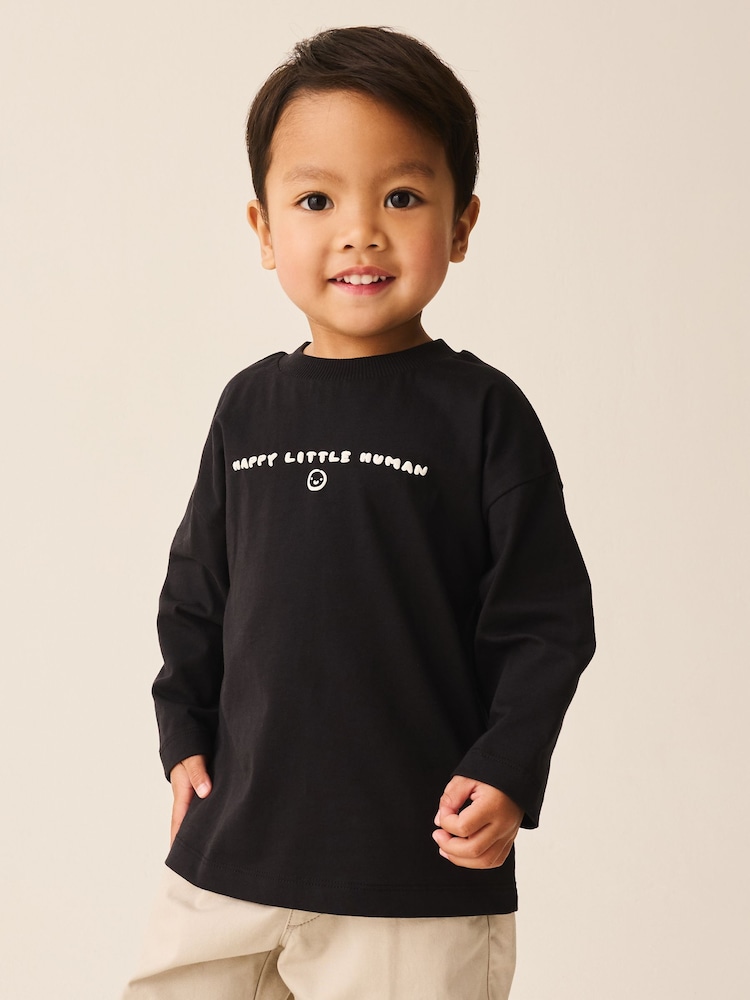 Black Happy Little Human Slogan Long Sleeve Small Graphic Printed T-Shirt (3mths-7yrs) - Image 1 of 4 Black Happy Little Human Slogan Long Sleeve Small Graphic Printed T-Shirt (3mths-7yrs) - Image 1 of 4