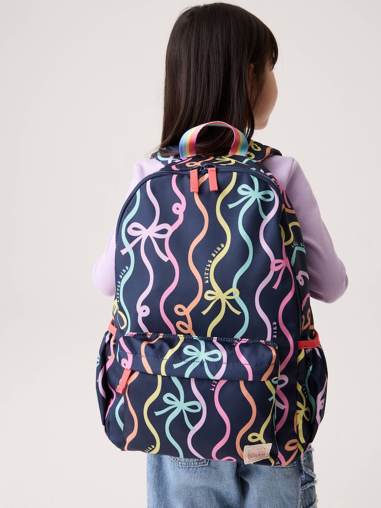 Little Bird by Jools Oliver Navy Back To School Pastel Rainbow Bow Backpack - Image 1 of 6 Little Bird by Jools Oliver Navy Back To School Pastel Rainbow Bow Backpack - Image 1 of 6