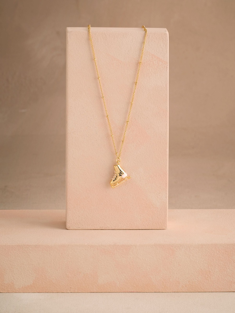 Cath Kidston Gold Tone Ice Skate Charm Cracker Box Necklace - Image 1 of 4 Cath Kidston Gold Tone Ice Skate Charm Cracker Box Necklace - Image 1 of 4