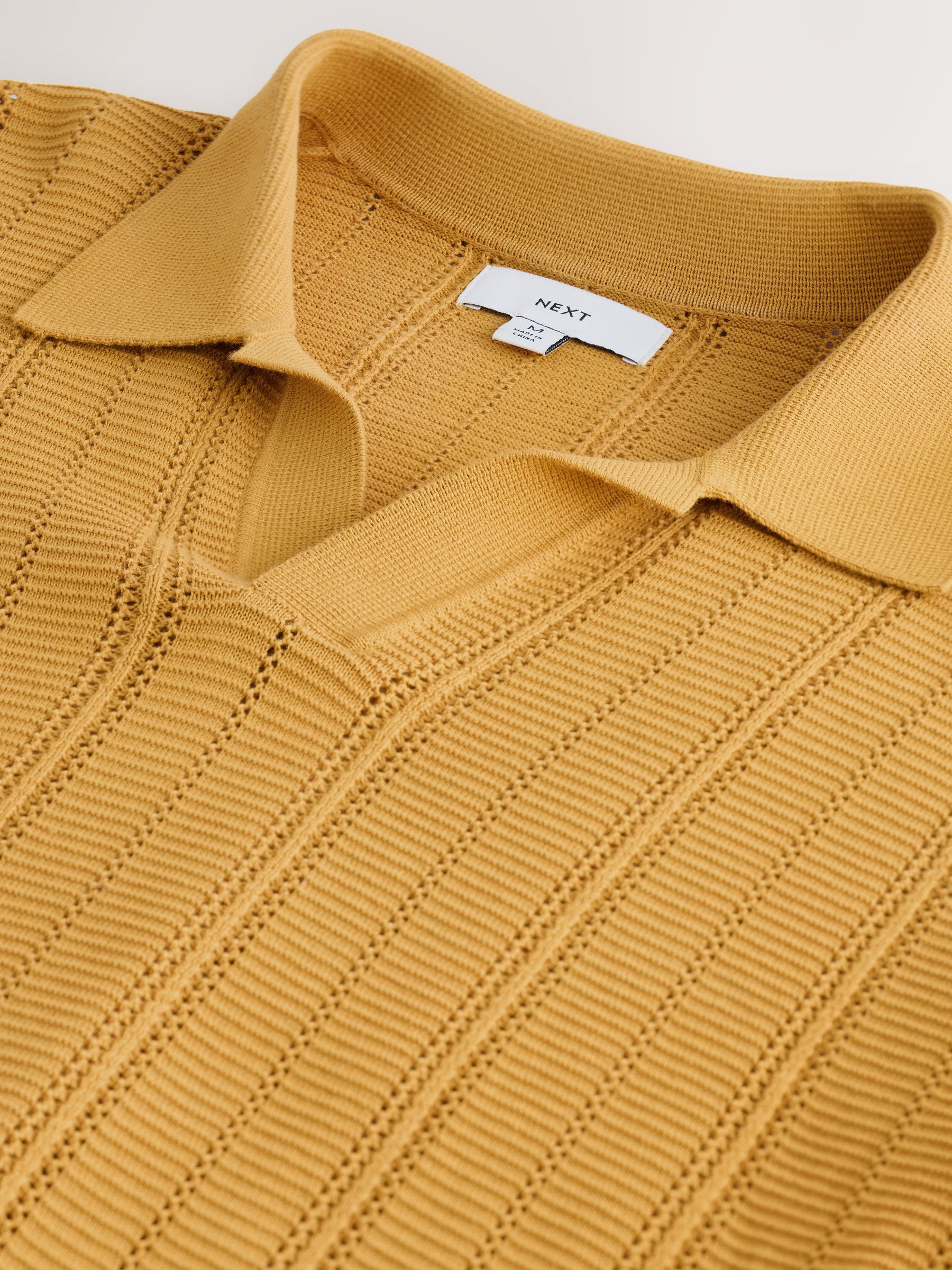 Buy Ochre Yellow Textured Knit Trophy Polo Shirt from Next USA