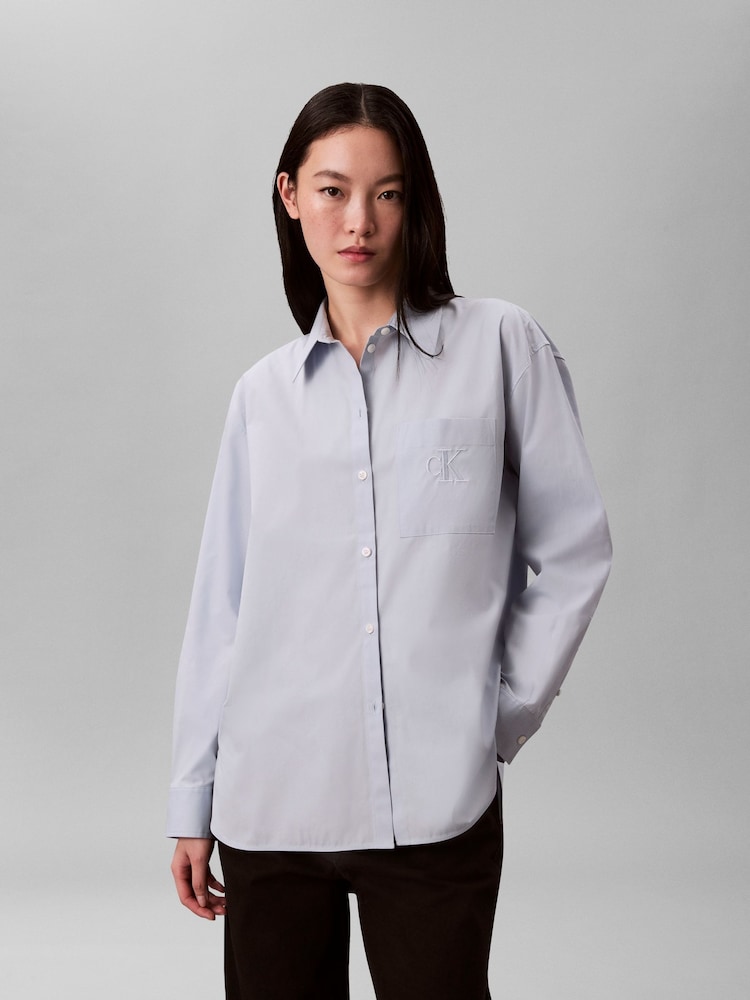 Calvin Klein Blue Poplin Relaxed Button-Down Shirt - Image 1 of 6 Calvin Klein Blue Poplin Relaxed Button-Down Shirt - Image 1 of 6