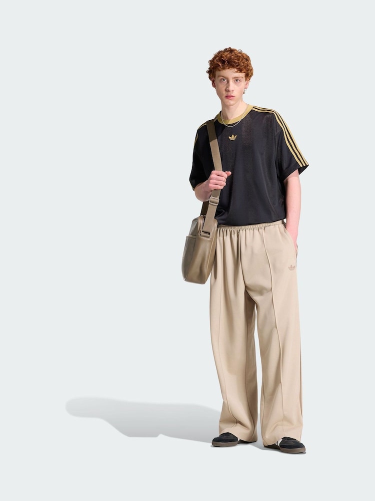 adidas Originals Black/Gold Adicolor Jacquard Jersey - Image 1 of 5 adidas Originals Black/Gold Adicolor Jacquard Jersey - Image 1 of 5