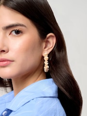 Aela Gold Tone Chipping Hoop Earrings - Image 1 of 3