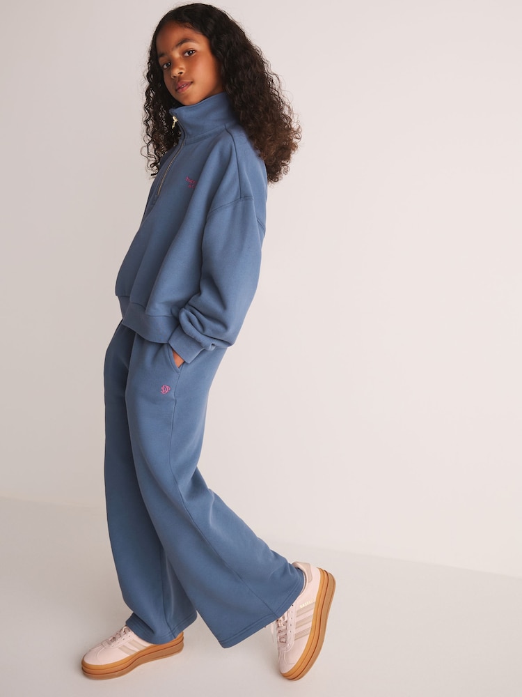 Superdry Blue Half Zip Sweatshirt and Wide Leg Joggers Set - Image 1 of 14 Superdry Blue Half Zip Sweatshirt and Wide Leg Joggers Set - Image 1 of 14