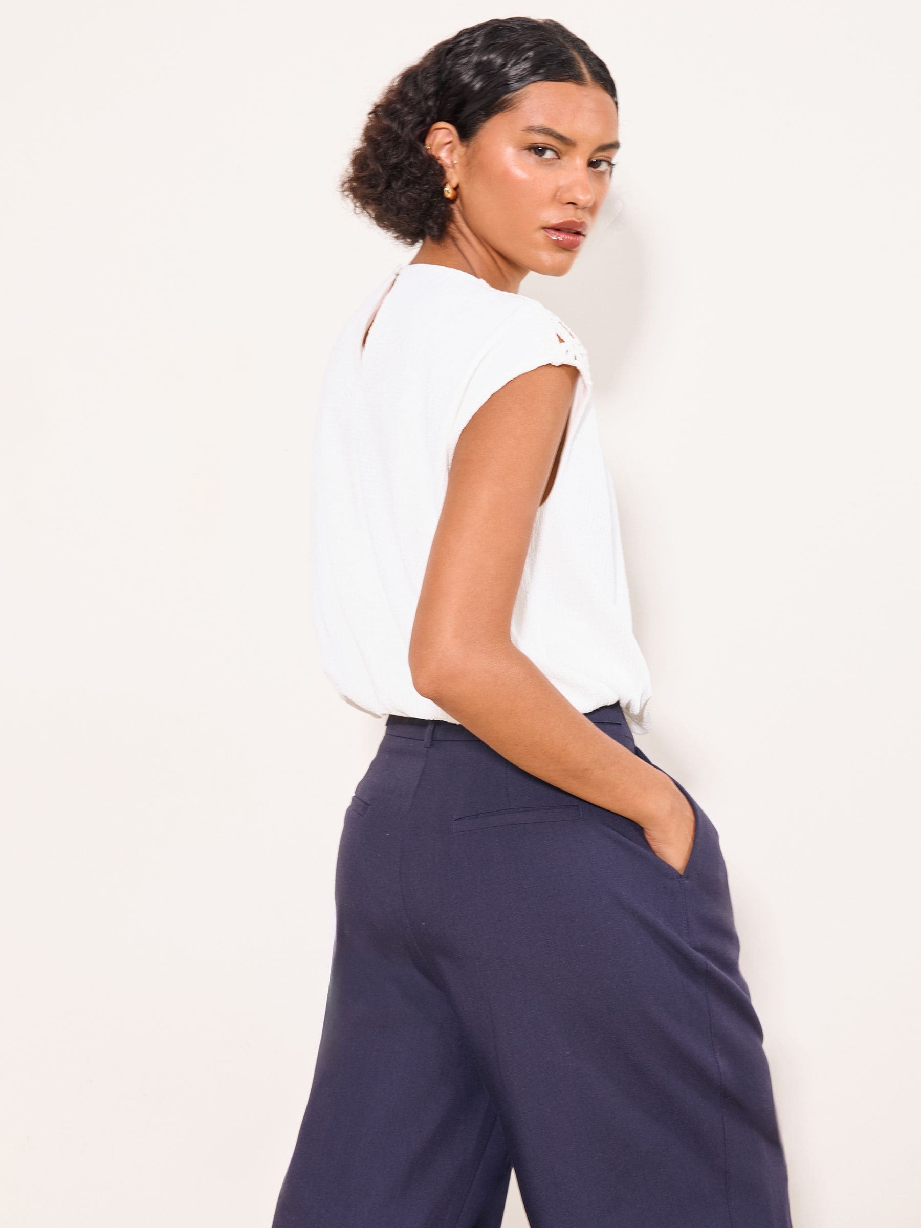 Buy Lipsy White Bubble Hem Crochet Shoulder Detail Top from the