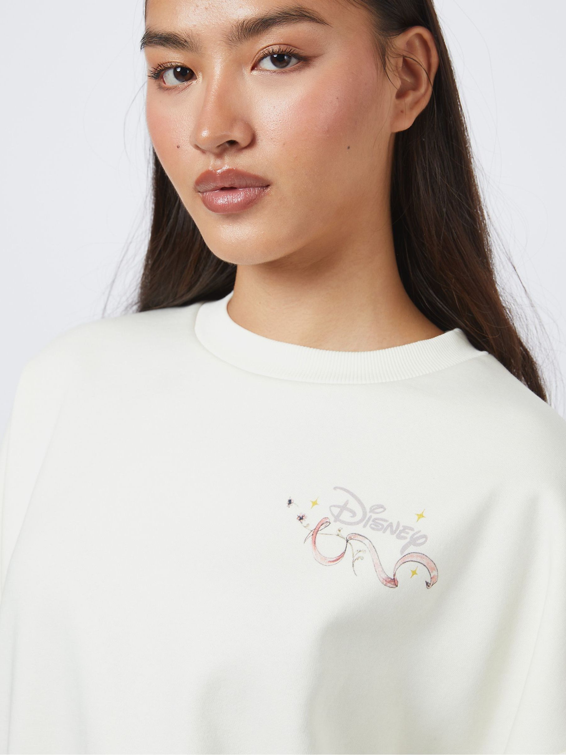 Buy Skinnydip Cream Disney Classics Poster Sweatshirt from the