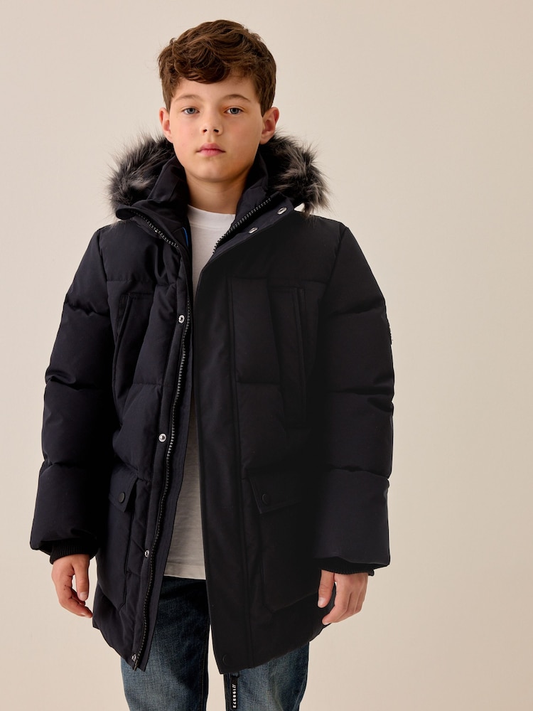 Black Heavyweight Shower Resistant Faux Fur Trim Parka Coat (3-16yrs) - Image 1 of 7 Black Heavyweight Shower Resistant Faux Fur Trim Parka Coat (3-16yrs) - Image 1 of 7