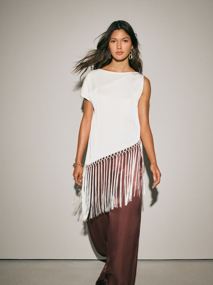 Ecru Sleeveless Asymmetric Fringe Tassel Top - Image 1 of 8 Ecru Sleeveless Asymmetric Fringe Tassel Top - Image 1 of 8