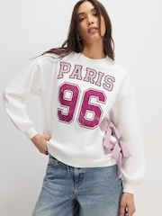 River Island Cream Long Sleeve Paris Poplin Bow Sweat Top - Image 1 of 4