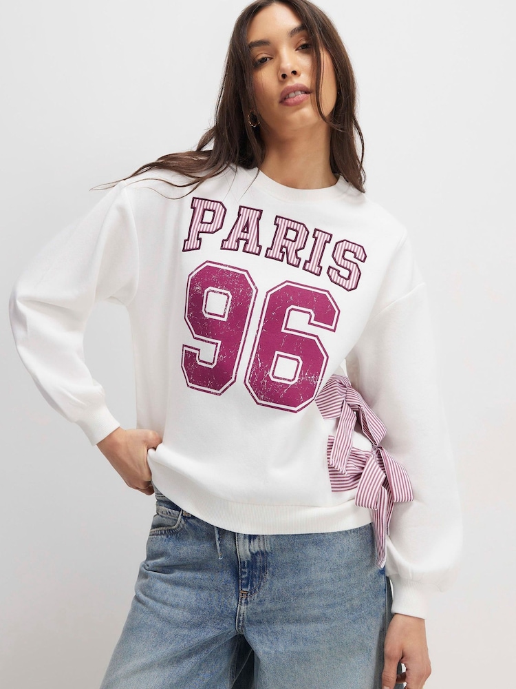 River Island Cream Long Sleeve Paris Poplin Bow Sweat Top - Image 1 of 4