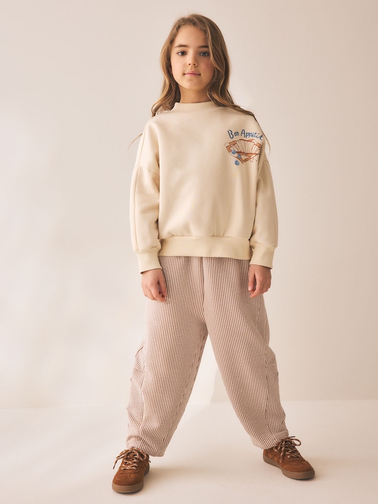 Neutral Pâtisserie Graphic Sweatshirt And Textured Trousers Set (3-16yrs) - Image 1 of 10 Neutral Pâtisserie Graphic Sweatshirt And Textured Trousers Set (3-16yrs) - Image 1 of 10
