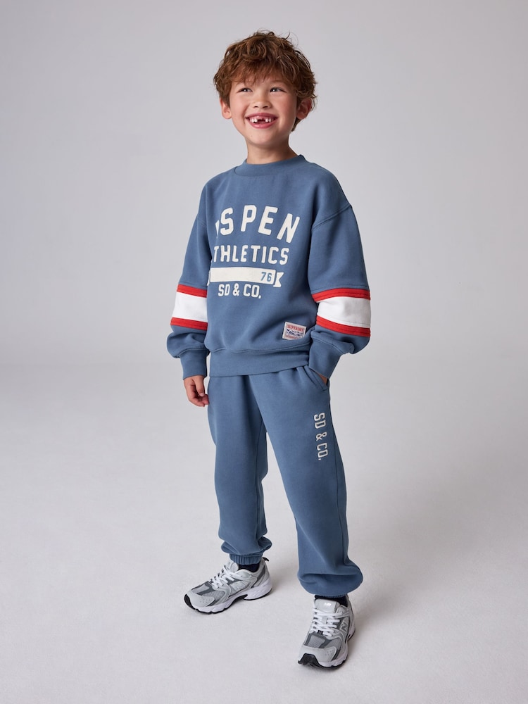 Superdry Blue Graphic Sweatshirt and Joggers Set - Image 1 of 13 Superdry Blue Graphic Sweatshirt and Joggers Set - Image 1 of 13