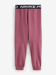 Przydymiony róż - Joggersy polarowe Nike Pro Dri-Fit - Obraz 5 z 9