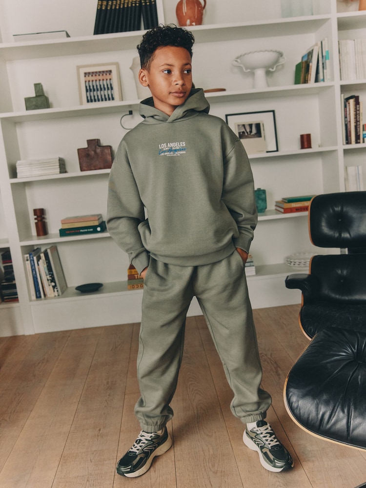 Soft Green Back Print Relaxed Fit Heavy Weight Hoody Jogger Set (3-16yrs) - Image 1 of 4 Soft Green Back Print Relaxed Fit Heavy Weight Hoody Jogger Set (3-16yrs) - Image 1 of 4
