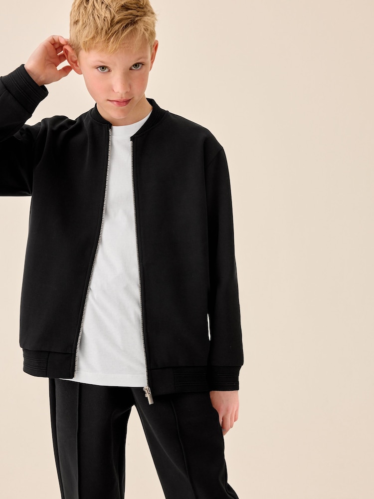 Czarny z tkaniny interlock - Elegancka kurtka bomberka (3–16 lat) - Obraz 2 z 11 Czarny z tkaniny interlock - Elegancka kurtka bomberka (3–16 lat) - Obraz 2 z 11